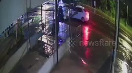 Brave market stall vendor jumps into pick-up truck to stop carjackers trying to steal it
