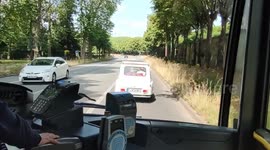 (Inner bus view) Tourists enjoy a travel in vintage Deux Chevaux (2CV) ( Two Horses) car, Paris suburb, Versailles, France. 27 june 2023