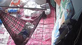 Baby hangs upside down and falls from hammock