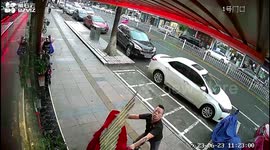 Chinese shopkeeper miraculously dodges falling asbestos roof in gusting winds and rain
