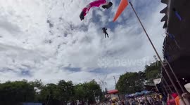Paraglider loses control and crashes through shop roof in Thailand