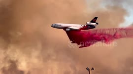 Airplane dumps fire-retardant chemical in Scottsdale, US, as blaze threatens neighbourhoods