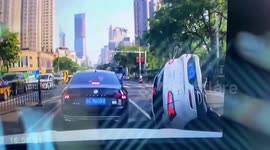 Motorists rescued after car falls into sinkhole that opened up on road in China