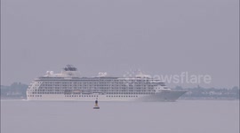 The World cruise ship departs the River Thames, UK