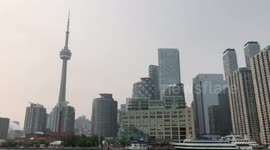 CN Tower in haze from wild fire smoke in Toronto Ontario Canada