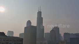 Drone view of Chicago loop with the haze from Canadian fires at the golden hour.
