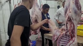 Palestinian butchers slaughter calves and sheeps on the second day of the Muslim feast of Eid al-Adha in the West Bank city of Hebron