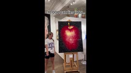 Artist creates incredible mosaic apple made from 10,000 SWEETS. PART 1/4