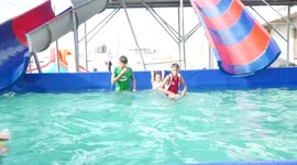 Palestinian children play inside the Water city on the second day of the Muslim feast of Eid al-Adha, in Gaza City