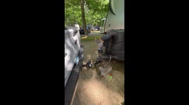 Tiny expert helps his dad park and perfectly align trailer hitch