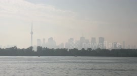 Wildfire smoke covers Toronto city skyline again