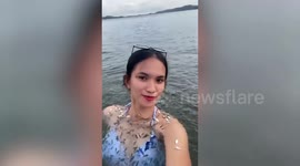 Beachgoer's selfie goes wrong as school of fish swim into her bikini
