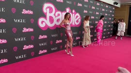 Jesinta Franklin gets sore feet on Barbie Vogue Australia event pink carpet in Sydney Australia