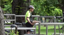 Locals exercise in Bangkok park on Saturday morning