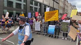 London Pride participants dance and mock religious anti-LGBT protesters reading from the bible during London Pride Parade