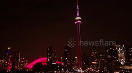 Canada Day CN Tower and Rogers Centre lit up Red at night