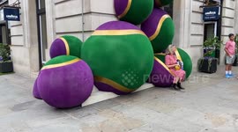 Giant Wimbledon-themed tennis balls decorate Lavazza cafe in central London