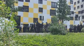 A company of police charges against demonstrators during violent clashes in Nanterre (France).