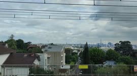 Panoramic inner train view on Paris and Eiffel Tower from Meudon, France. 3 july 2023