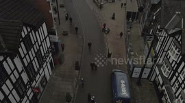 people walking in the citry top drone shot wigan