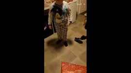Children are a surprised with a cute puppy as Christmas Present