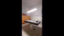 Exploring an abandoned German morgue with coffins, working electricity and a black autopsy table