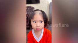 Little girl looks like balding old man after cutting her own hair