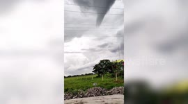 Huge tornado descends damaging homes during storm in the Philippines