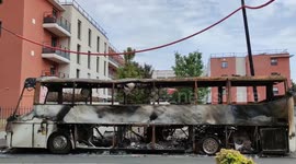 Charred remains of coach after Paris rioters vent anger over teenager's death