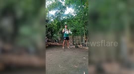Young lad juggles four bottles to show off flair bartending skills