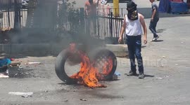 Tyres set alight as Palestinians protest Israel's deadly raid on Jenin