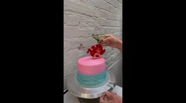 Cake artist decorates a fascinating Little Mermaid cake for a young Ariel fan