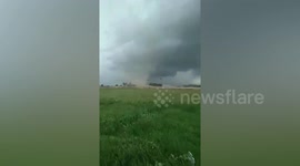 Tornado wreaks havoc picking up debris across field in the Philippines