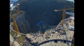Aerial footage of Chinese hotel being built in a giant hole in the ground
