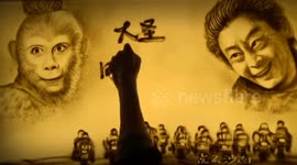 Sand painting “Monkey King goes back home to celebrate Chinese New Year”