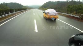 Driver lucky to escape after collision with lorry on Chinese motorway