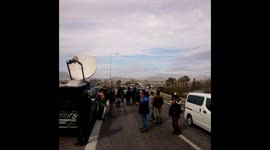 Travellers walk as Athens airport road blocked by protesting farmers