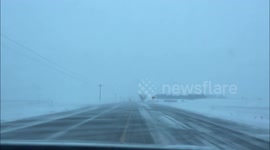 Snow Drifts On Minnesota Roads Surprise Unsuspecting Driver.