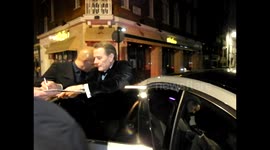 Bryan Cranston signs autographs for fans after a post-BAFTA party