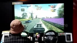 70-year-old woman plays racing game at arcade