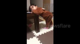 Cute youngster nods off while standing up in China's Shandong
