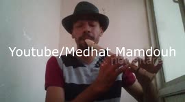 Man freestyle beat boxes while playing the recorder