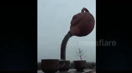 Huge teapot shaped sculpture is built in the air near tea factory