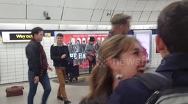 Londoners take moment out of tube journey to dance to busker's music