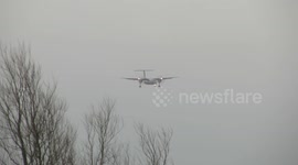 Plane landing in strong wind at Leeds Bradford Airport
