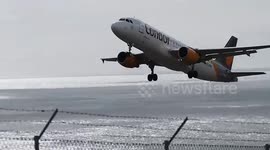 Plane bails out of landing at the last second due to heavy cross winds