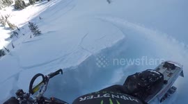 Snowmobile triggers avalanche