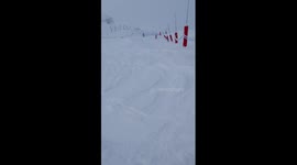 Skier faceplants after jump