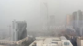 See a storm rolling through a city in lightning speed