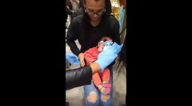 Cute Baby girl cries while getting her ear piercings